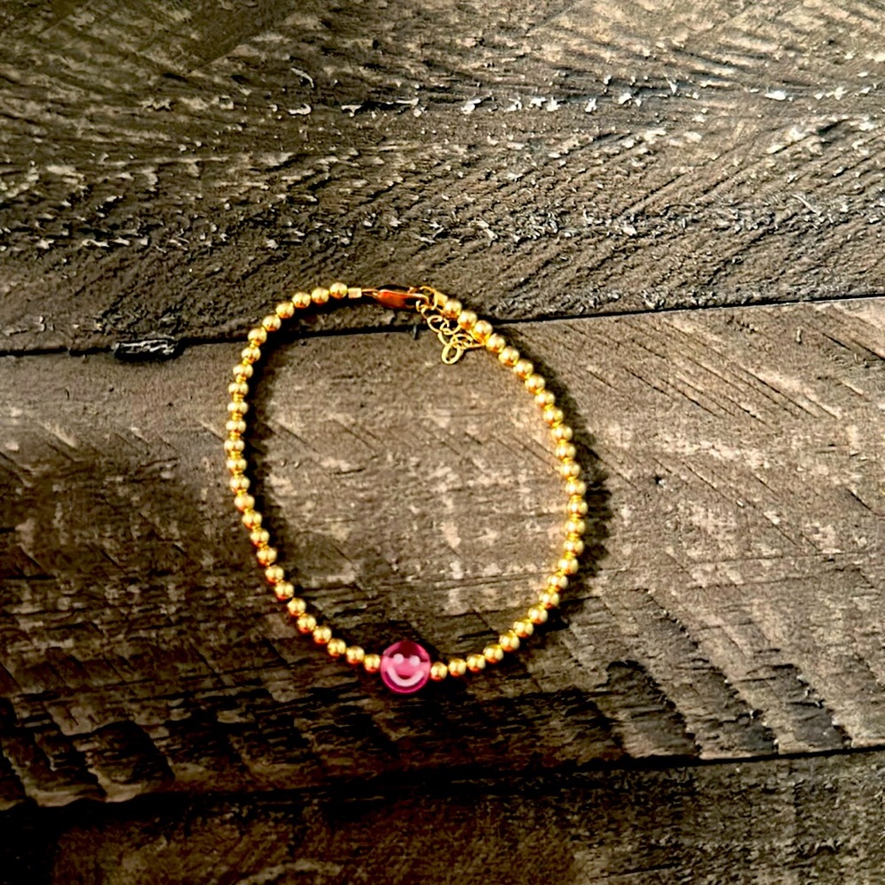 Pink smiley face bracelet